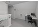 Office space with carpet, a desk, and an ironing board at 1871 Sandy Trail Dr, Hampton, GA 30228