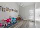 Bright room with a play area and vinyl plank flooring at 1871 Sandy Trail Dr, Hampton, GA 30228