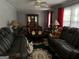 Cozy living room with plush seating, a decorative rug, and ample natural light at 1254 Ne Woodland Rd, Conyers, GA 30012