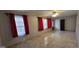 Bright living area with large windows, tile flooring, and neutral-toned walls at 1254 Ne Woodland Rd, Conyers, GA 30012