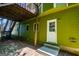 Green house, white trim, wooden stairs lead to back door at 133 Deerfield Ln, Carrollton, GA 30116