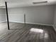 Spacious unfinished basement with wood-look flooring at 133 Deerfield Ln, Carrollton, GA 30116