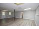 Finished basement featuring wood-look floors, updated lighting, and neutral paint at 133 Deerfield Ln, Carrollton, GA 30116