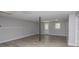 Finished basement features wood-look floors, updated lighting, and neutral paint at 133 Deerfield Ln, Carrollton, GA 30116