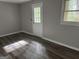 Bedroom showcases wood-look flooring and natural light at 133 Deerfield Ln, Carrollton, GA 30116