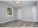 Cozy bedroom featuring neutral paint, carpet flooring, and a bright window at 133 Deerfield Ln, Carrollton, GA 30116