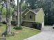 Charming two-story home with green siding and a well-maintained lawn surrounded by mature trees at 133 Deerfield Ln, Carrollton, GA 30116