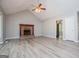 Bright living room with brick fireplace and modern flooring at 133 Deerfield Ln, Carrollton, GA 30116