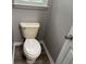 Bathroom featuring a standard toilet and baseboards at 133 Deerfield Ln, Carrollton, GA 30116