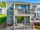 Exterior view highlighting multi-level balconies with sliding glass doors at 325 Berry Ct, Villa Rica, GA 30180