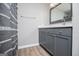 Stylish bathroom features a modern vanity with ample storage and sleek fixtures, adding a touch of elegance at 325 Berry Ct, Villa Rica, GA 30180