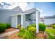 A charming front porch with a garden is framed by green bushes at 325 Berry Ct, Villa Rica, GA 30180
