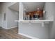 Kitchen view showcasing a breakfast bar, modern stainless steel appliances, and light countertops at 325 Berry Ct, Villa Rica, GA 30180