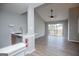 An open living area features vaulted ceilings, a ceiling fan, and an adjacent kitchenette at 325 Berry Ct, Villa Rica, GA 30180