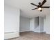 Bright living room with a modern ceiling fan and neutral paint, providing a calming atmosphere at 325 Berry Ct, Villa Rica, GA 30180
