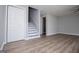 A bright living room with wood floors features access to an upstairs and closet for convenience at 325 Berry Ct, Villa Rica, GA 30180