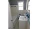 Bathroom features a vanity, tub, and neutral-toned tile at 5243 Eubanks Dr, Lake City, GA 30260