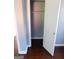 Hallway closet featuring an open door with a rod for hanging clothes at 5243 Eubanks Dr, Lake City, GA 30260