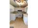 Well-maintained kitchen featuring white cabinetry and laminate countertops at 5243 Eubanks Dr, Lake City, GA 30260