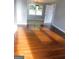 Bright living room with hardwood floors and lots of natural light at 5243 Eubanks Dr, Lake City, GA 30260