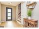 Entryway featuring wood floors, front door with glass and staircase at 10 Queens Ct, Sharpsburg, GA 30277