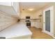 Well-appointed kitchen boasts white cabinets, stainless steel appliances, and quartz countertops, ready for cooking at 10 Queens Ct, Sharpsburg, GA 30277