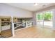 Bright living room with open floor plan, glass sliding doors, and upstairs loft view at 10 Queens Ct, Sharpsburg, GA 30277