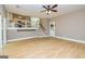 Spacious open floor plan living room featuring wood floors and plenty of natural light at 10 Queens Ct, Sharpsburg, GA 30277