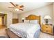 Inviting main bedroom featuring a ceiling fan and ample space for rest and relaxation at 10 Queens Ct, Sharpsburg, GA 30277