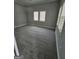 Neutral bedroom featuring plush carpeting, base molding, and two windows offering lots of natural light at 937 Sw Metropolitan Sw, Atlanta, GA 30310