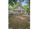 Charming house featuring a welcoming front porch with large white columns and horizontal railing at 937 Sw Metropolitan Sw, Atlanta, GA 30310