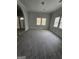 Bright and airy living room with plush carpeting, neutral paint, and natural light from several windows at 937 Sw Metropolitan Sw, Atlanta, GA 30310