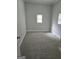 Bedroom boasts neutral walls, base trim, plush carpeting, and windows at 937 Sw Metropolitan Sw Pkwy, Atlanta, GA 30310