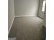 Bedroom boasts neutral walls, base trim, plush carpeting, and a window at 937 Sw Metropolitan Sw Pkwy, Atlanta, GA 30310