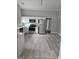Bright kitchen features stainless steel appliances, white cabinets, and hardwood floors at 937 Sw Metropolitan Sw Pkwy, Atlanta, GA 30310