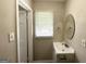 Well-lit bathroom with modern vanity, contemporary fixtures, and a neutral color scheme at 2165 Pemberton Rd, Atlanta, GA 30331