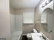 Bright bathroom featuring a tub/shower combination and a vanity with modern fixtures at 2165 Pemberton Rd, Atlanta, GA 30331