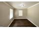 Cozy bedroom featuring hardwood floors, neutral walls, and natural light from a window at 2165 Pemberton Rd, Atlanta, GA 30331