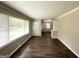 Spacious living area with hardwood floors, large windows, and a view to an additional room at 2165 Pemberton Rd, Atlanta, GA 30331