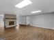 Large basement with fireplace, vinyl floors and abundant natural light at 230 Shorewood Ct, Mcdonough, GA 30252
