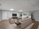Finished basement living area with stylish seating and modern entertainment setup, offering a versatile living space at 230 Shorewood Ct, Mcdonough, GA 30252