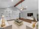 Inviting living room featuring custom built-ins, plush seating, and a stylish coffee table at 230 Shorewood Ct, Mcdonough, GA 30252