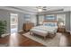 A serene bedroom with hardwood floors, offering a peaceful retreat with great natural light and neutral tones at 230 Shorewood Ct, Mcdonough, GA 30252