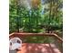A view of the back deck and wooded backyard at 190 Princeton Way, Covington, GA 30016
