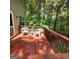 The back deck featuring seating and a treed backdrop at 190 Princeton Way, Covington, GA 30016