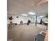 Spacious basement with neutral carpet, white walls, drop ceiling, vintage bar, and natural light from a window at 190 Princeton Way, Covington, GA 30016