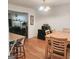 Bright dining room featuring a wooden table and chairs with a hardwood floor at 190 Princeton Way, Covington, GA 30016