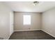 Bedroom featuring carpeting, window, and a closet providing storage space at 115 Fairview Way, Stockbridge, GA 30281