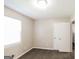 Bedroom featuring plush carpeting, window, and a closet for storage at 115 Fairview Way, Stockbridge, GA 30281