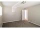 Bedroom with carpeting, a window for natural light, and an open door at 115 Fairview Way, Stockbridge, GA 30281